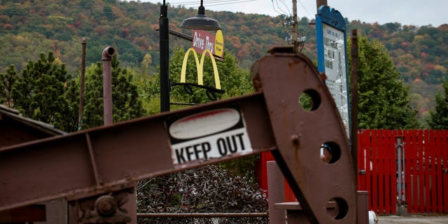 An oil pumpjack operates in the drive-thru area of a McDonald's in Bradford, Pennsylvania, near the New York border.