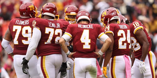 Taylor Heinicke (4) of the Washington Football Team reacts during the second half against the New Orleans Saints at FedEx Field Oct. 10, 2021, in Landover, Md.