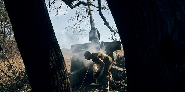 A Ukrainian soldier fires on the front line in the Donetsk region, eastern Ukraine, Sat. Sept. 3. The Biden administration will send Ukraine a new 5 million package of weapons.