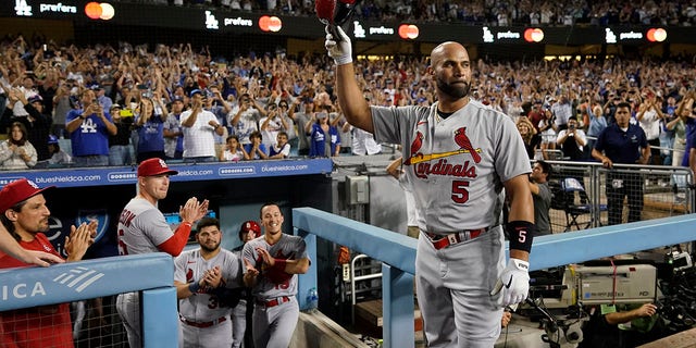 St. Louis Cardinals designated hitter Albert Pujols (5) celebrates after hitting a home run during the fourth inning of a baseball game against the Los Angeles Dodgers in Los Angeles, Friday, Sept. 23, 2022. Brendan Donovan and Tommy Edman also scored. It was Pujols' 700th career home run.