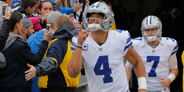 Dallas Cowboys quarterback Dak Prescott (4) and quarterback Cooper Rush (7) head for the field before the game as the Dallas Cowboys play the Washington Redskins on Sunday, Oct. 29, 2017 at FedEx Field in Landover, Md.