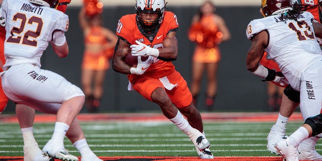 Oklahoma State Cowboys running back Dominic Richardson (20) looks for an opening during a game against the Central Michigan Chippewas Sept. 1, 2022, at Boone Pickens Stadium in Stillwater, Okla.