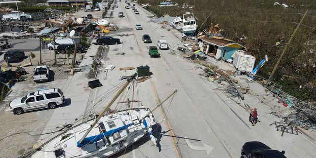 Displaced boats rest lie strewn along the San Carlos Boulevard, one day of the passage of Hurricane Ian, in Fort Myers Beach, Fla., Thursday, Sept. 29, 2022.