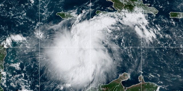 This satellite image provided by the National Oceanic and Atmospheric Administration shows Tropical Storm Ian over the central Caribbean on Saturday, Sept. 24, 2022.