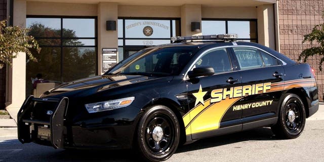 FILE- A police cruiser is seen outside the Henry County Sheriff's Office in McDonough, Ga.