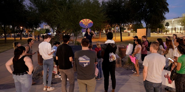 Protesters gather outside the Capitol to voice their dissent with an abortion ruling, Friday, Sept. 23, 2022, in Phoenix.