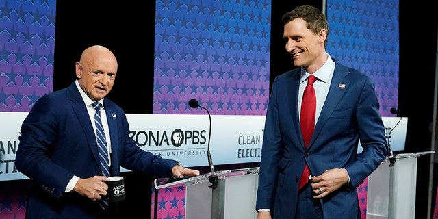 Arizona Democratic Sen. Mark Kelly, left, and his Republican challenger Blake Masters, right, on Thursday, Oct. 6, 2022.