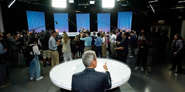 "Arizona Horizon" host and managing editor Ted Simons sits on the set as members of the media cover Arizona Democratic Sen. Mark Kelly, Republican candidate Blake Masters, and Libertarian candidate Marc Victor prior to a televised debate in Phoenix, Thursday, Oct. 6, 2022.