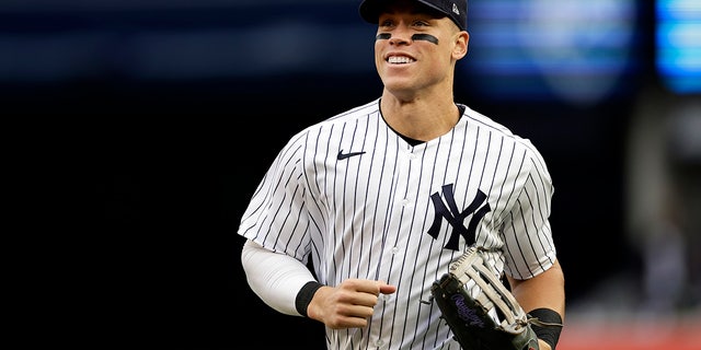 New York Yankees right fielder Aaron Judge runs to the dugout during the sixth inning of the team's baseball game against the Baltimore Orioles on Saturday, Oct. 1, 2022, in New York.