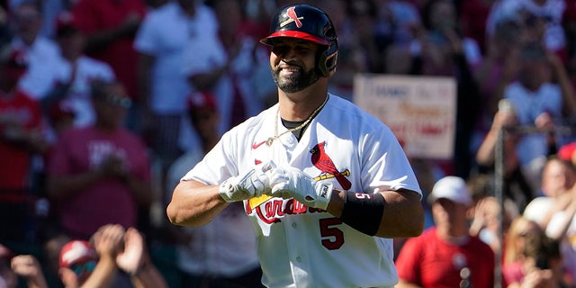St. Louis Cardinals' Albert Pujols celebrates after hitting a solo home run during the third inning of a baseball game against the Pittsburgh Pirates Sunday, Oct. 2, 2022, in St. Louis.