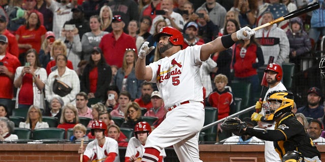 St. Louis Cardinals designated hitter Albert Pujols (5) hits his 701st home run in the fourth inning during a MLB game between the Pittsburgh Pirates and the St. Louis Cardinals, September 30, 2022, at Busch Stadium, St. Louis, MO.