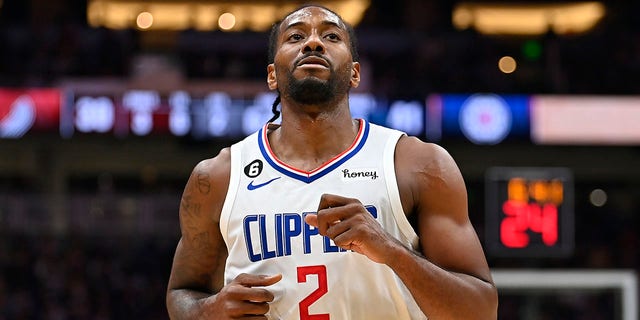 Kawhi Leonard of the Los Angeles Clippers looks on during the first half of a preseason game against the Portland Trail Blazers at Climate Pledge Arena Oct. 3, 2022 in Seattle. The Clippers won 102-97.