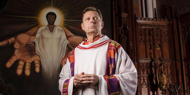 Roman Catholic Father Michael Pfleger poses in Saint Sabina Catholic Church in in Chicago January 9, 2009.
