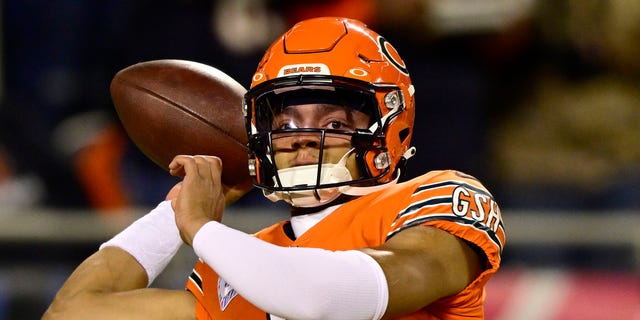 Justin Fields of the Chicago Bears warms up before the game against the Washington Commanders at Soldier Field on Oct. 13, 2022, in Chicago.